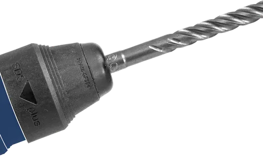 Máy khoan búa quay có đầu khoan xoắn ốc gắn vào đầu kẹp.